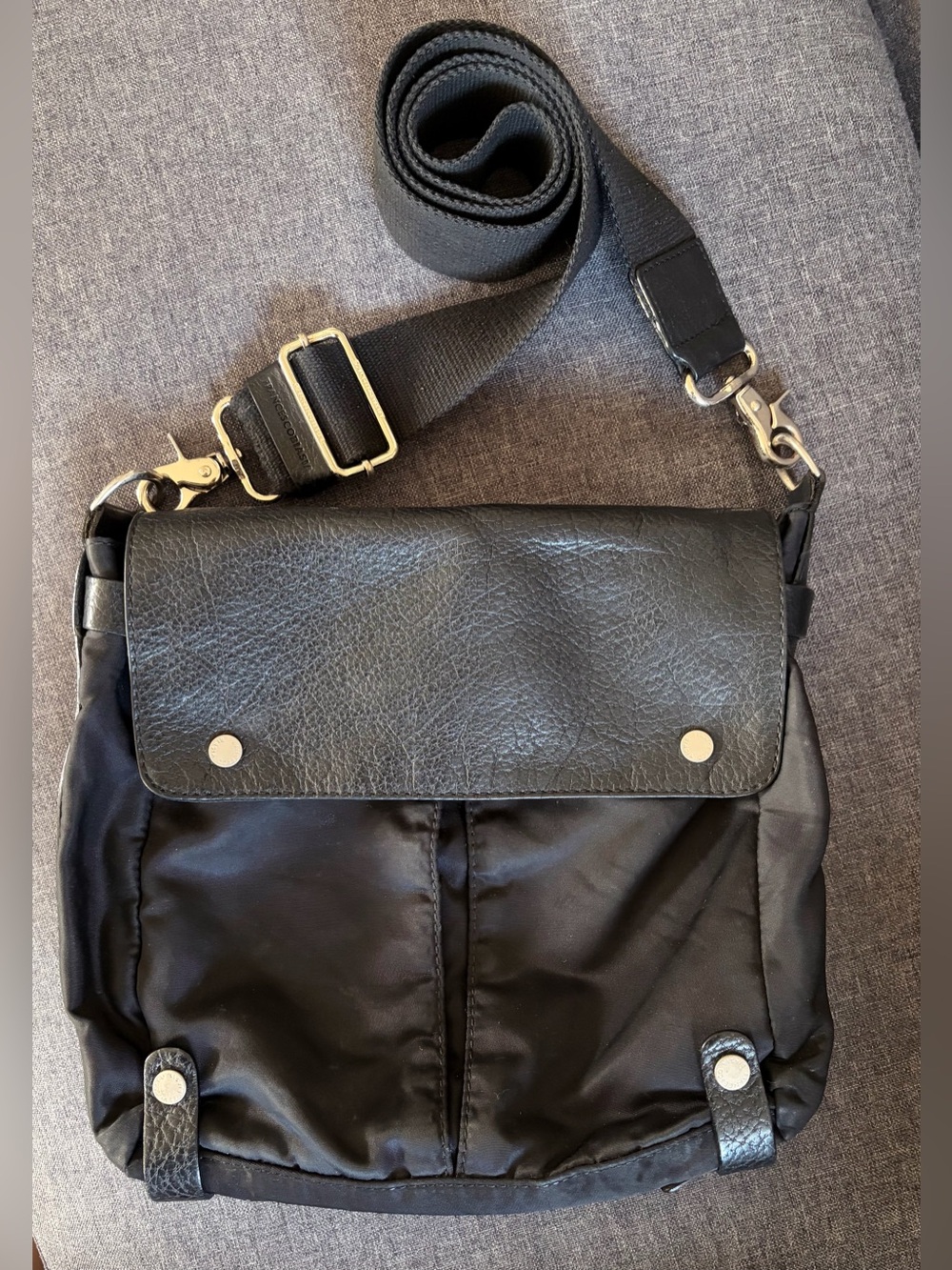 Francesco Biasia multi-pocket black messenger crossbody bag.